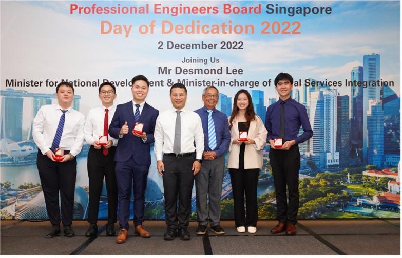 PEB Gold medal winners on stage with Minister. In total, 6 students from NUS and 6 students from NTU